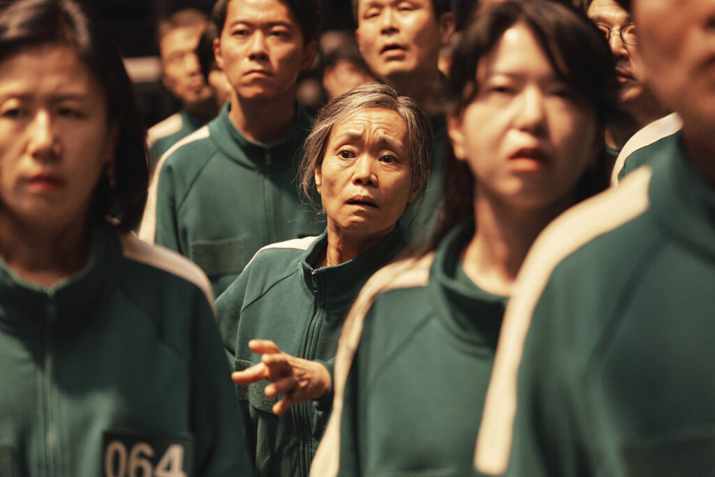 a group of people in green tracksuits